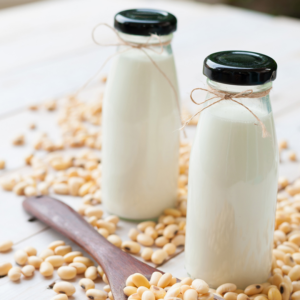 Two glass bottles with homemade soy milk